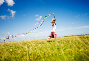 Little Girl Running with streamers